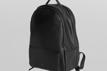 real leather flap pocket round backpack
